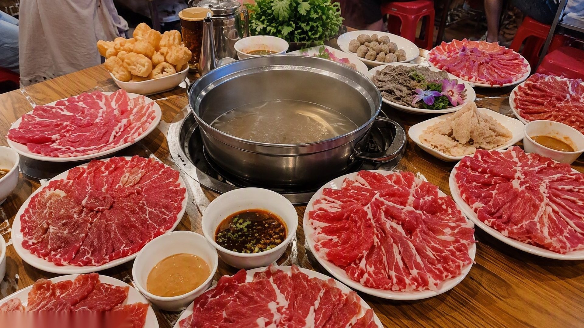 Chaoshan beef hotpot — paper-thin slices, clear broth, and the famous shacha sauce